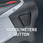 Tour V5 laser rangefinder by Bushnell Golf demonstration photo of yards/meters button.